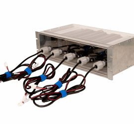 Metal battery pack with four sets of black and red wires connected, secured with blue straps, isolated on white background.