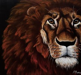 © 2021 RKS Photography | https://www.rksshots.com. Photo by RKS Photography. Painting of a lion’s face with a dark background, highlighting its mane and intense gaze.